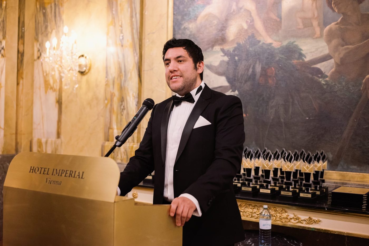 Christian Martinez speaking at an awards ceremony at the Hotel Imperial, Vienna